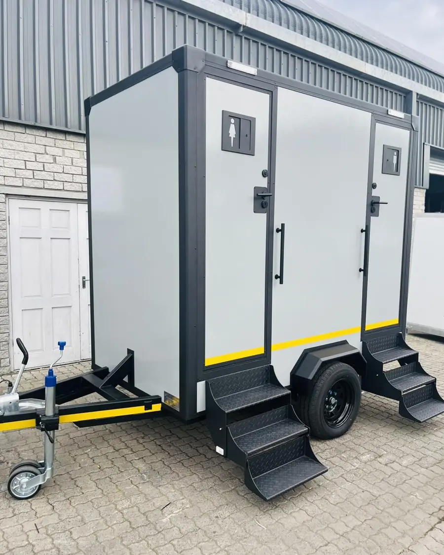 Two-stall towable restroom trailer with steps